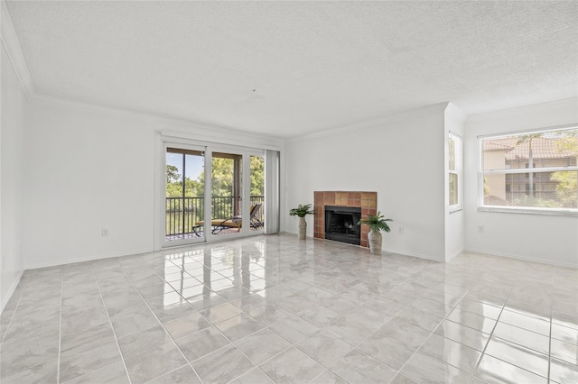 2400 Feather Sound Dr Unit 528, Clearwater, FL 33762 - unfurnished living room with ornamental molding, a textured ceiling, a tiled fireplace, and marble finish floors