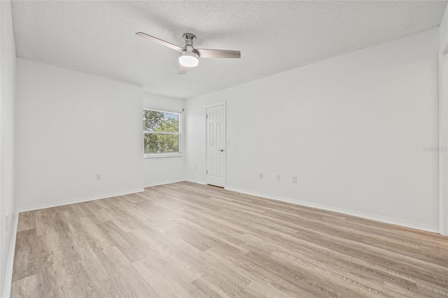 2400 Feather Sound Dr Unit 528, Clearwater, FL 33762 - empty room featuring a ceiling fan, light wood-type flooring, and a textured ceiling