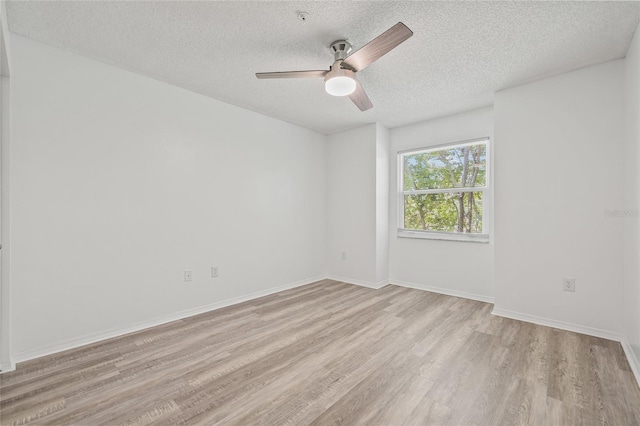 2400 Feather Sound Dr Unit 528, Clearwater, FL 33762 - unfurnished room featuring a ceiling fan, light wood-type flooring, and a textured ceiling