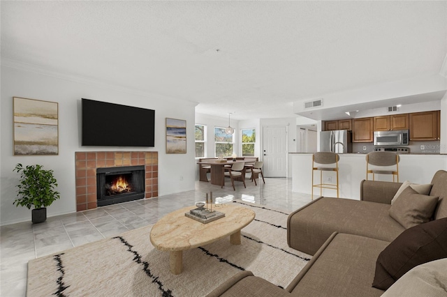 2400 Feather Sound Dr Unit 528, Clearwater, FL 33762 - living room featuring a fireplace and baseboards