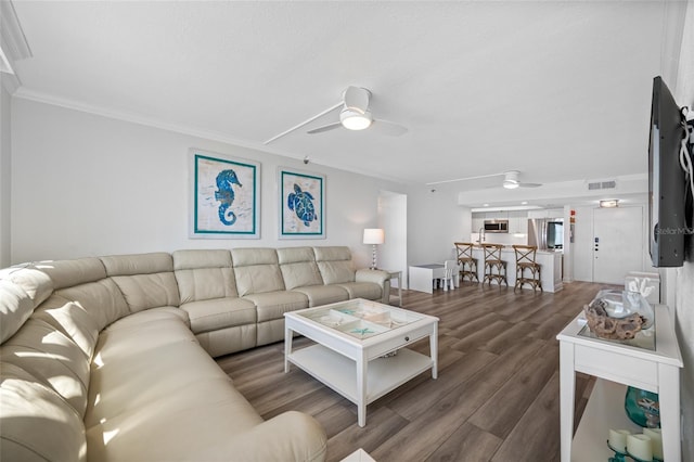 6372 Palma Del Mar Blvd S Unit 601, Saint Petersburg, FL 33715 - living area with ceiling fan, wood finished floors, and ornamental molding