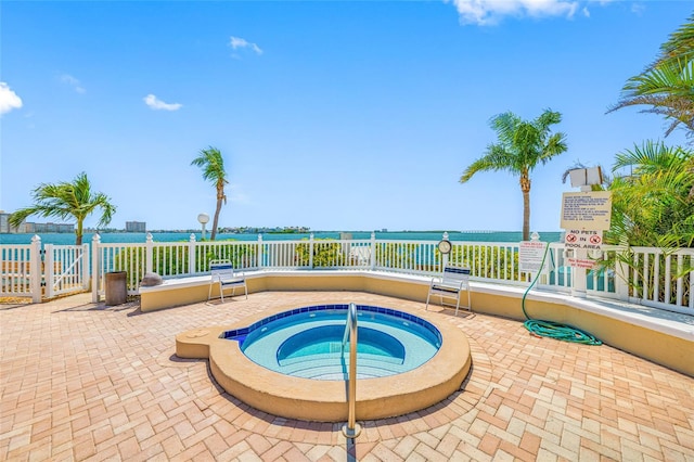 6372 Palma Del Mar Blvd S Unit 601, Saint Petersburg, FL 33715 - view of pool with a community hot tub, a water view, and a patio area