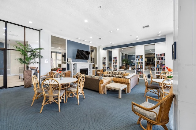 6372 Palma Del Mar Blvd S Unit 601, Saint Petersburg, FL 33715 - dining space featuring carpet, a fireplace, recessed lighting, and a textured ceiling
