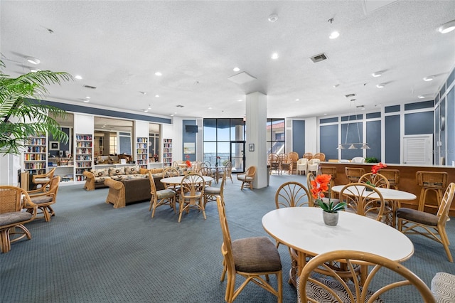 6372 Palma Del Mar Blvd S Unit 601, Saint Petersburg, FL 33715 - carpeted dining space with recessed lighting and a textured ceiling
