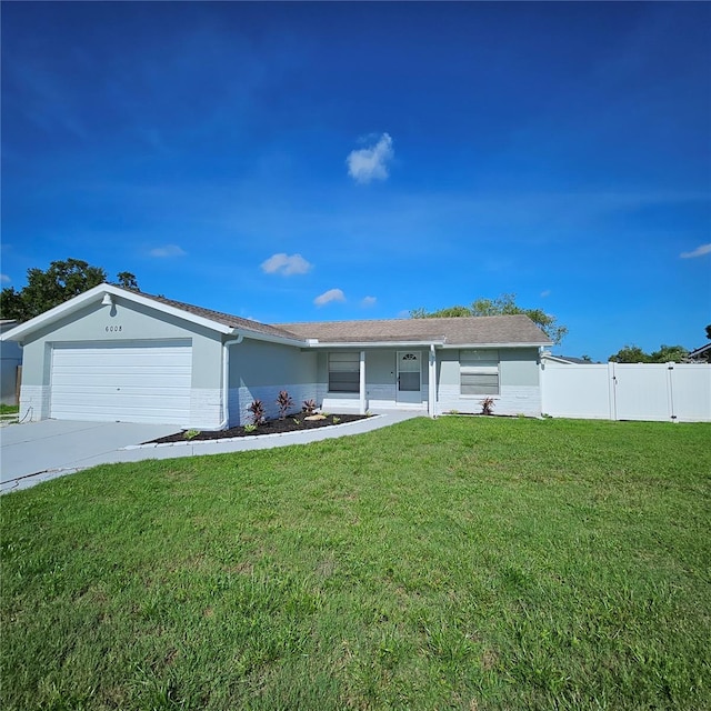 6008 Firefly Ln, Apollo Beach, FL 33572 - ranch-style house featuring an attached garage, driveway, and stucco siding
