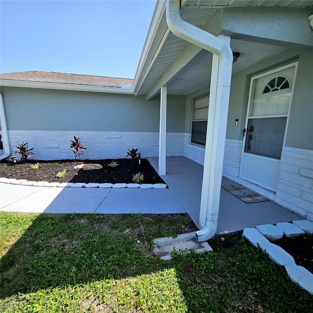 6008 Firefly Ln, Apollo Beach, FL 33572 - view of home's exterior with brick siding and roof with shingles