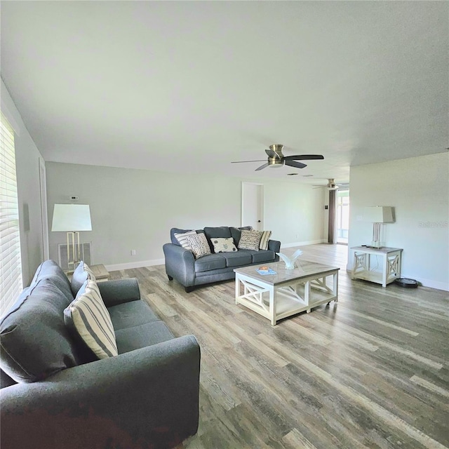 6008 Firefly Ln, Apollo Beach, FL 33572 - living room with ceiling fan and wood finished floors