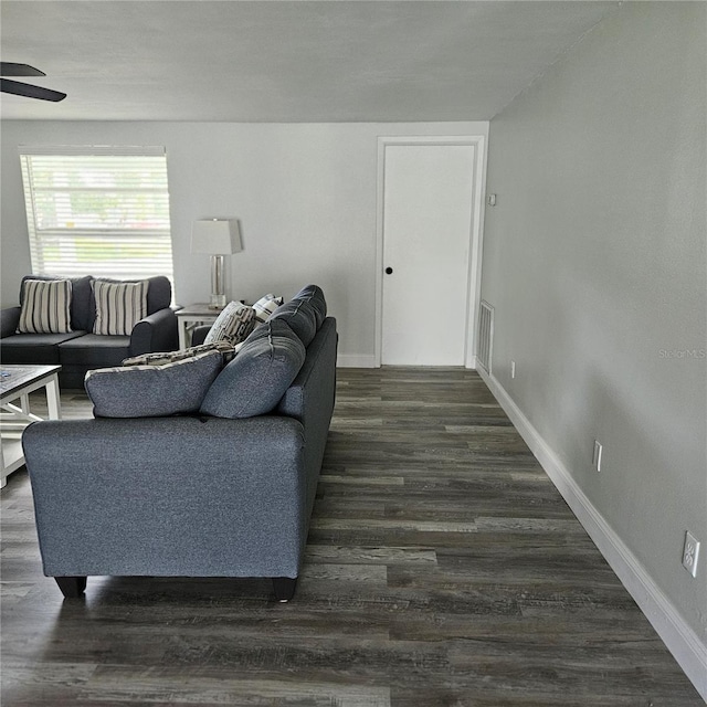 6008 Firefly Ln, Apollo Beach, FL 33572 - living room featuring a ceiling fan and dark wood-type flooring