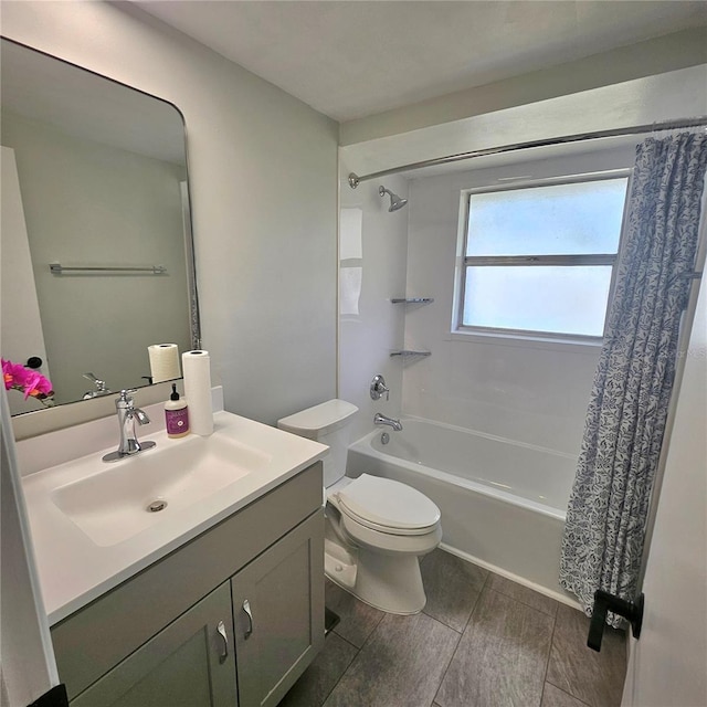 6008 Firefly Ln, Apollo Beach, FL 33572 - full bathroom with shower / bath combination with curtain, vanity, and wood finish floors