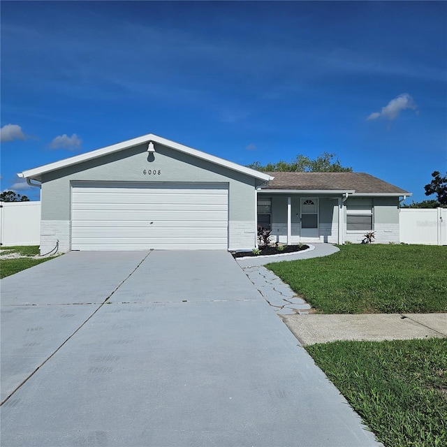 6008 Firefly Ln, Apollo Beach, FL 33572 - ranch-style house featuring driveway, brick siding, and a garage