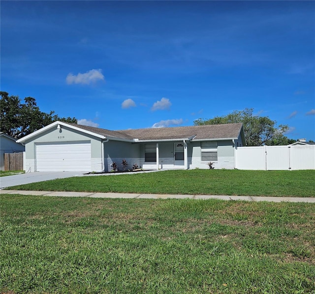 6008 Firefly Ln, Apollo Beach, FL 33572 - ranch-style home featuring a garage and concrete driveway