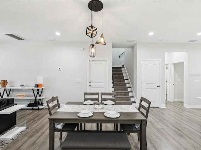 2809 N 21st St, Tampa, FL 33605 - dining room with stairs, light wood-type flooring, and recessed lighting
