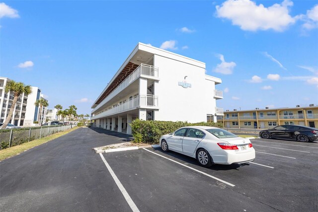 9755 Harrell Ave Unit 101, Treasure Island, FL 33706 - view of building exterior featuring uncovered parking