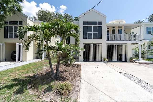 3412 W San Juan St Unit A, Tampa, FL 33629 - view of front facade with stucco siding and concrete driveway