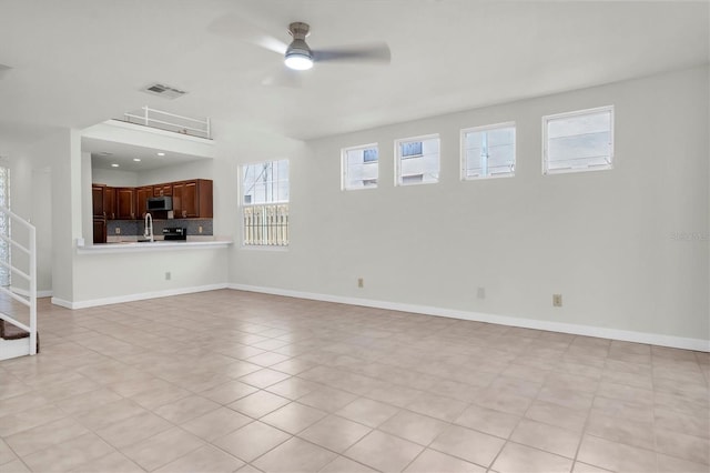 3412 W San Juan St Unit A, Tampa, FL 33629 - unfurnished living room with ceiling fan and light tile patterned floors