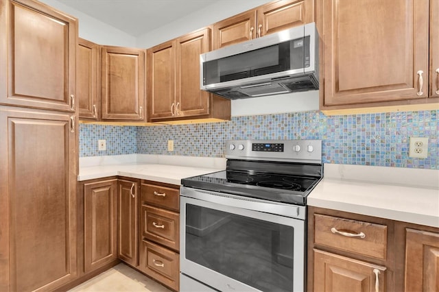 3412 W San Juan St Unit A, Tampa, FL 33629 - kitchen featuring stainless steel appliances, light countertops, and tasteful backsplash