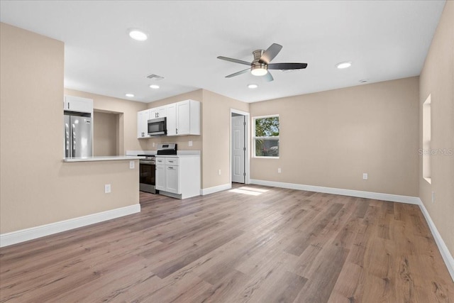 21536 Holdern Ave, Port Charlotte, FL 33952 - unfurnished living room with ceiling fan, baseboards, light wood-style flooring, and recessed lighting