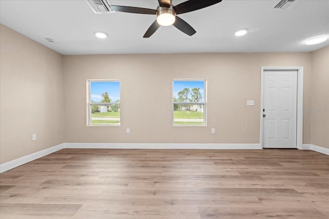 21536 Holdern Ave, Port Charlotte, FL 33952 - unfurnished room with plenty of natural light, light wood-type flooring, baseboards, and recessed lighting
