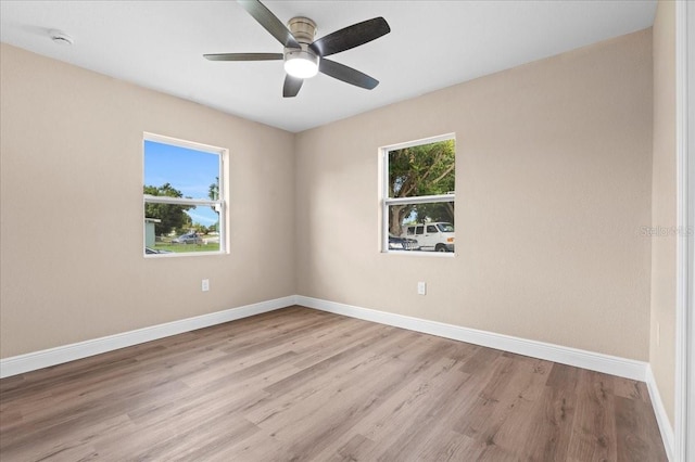 21536 Holdern Ave, Port Charlotte, FL 33952 - empty room with baseboards, wood finished floors, a ceiling fan, and a smoke detector