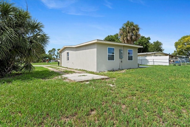 21536 Holdern Ave, Port Charlotte, FL 33952 - rear view of property featuring stucco siding and a patio area