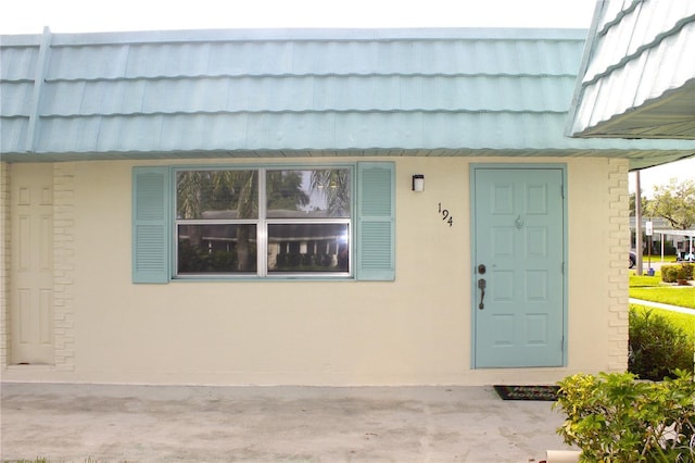101 Cambridge Trl Unit 194, Sun City Center, FL 33573 - doorway to property with mansard roof