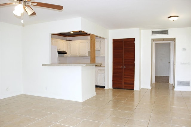 101 Cambridge Trl Unit 194, Sun City Center, FL 33573 - unfurnished living room with a ceiling fan, light tile patterned floors, and baseboards