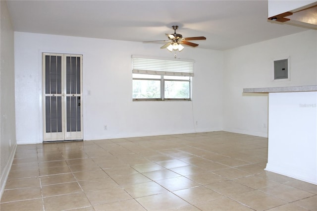 101 Cambridge Trl Unit 194, Sun City Center, FL 33573 - spare room with electric panel, light tile patterned floors, a ceiling fan, and baseboards