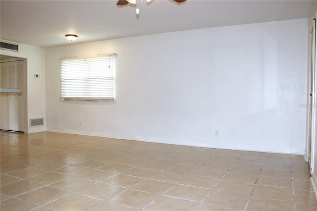 101 Cambridge Trl Unit 194, Sun City Center, FL 33573 - empty room with ceiling fan, light tile patterned flooring, and baseboards