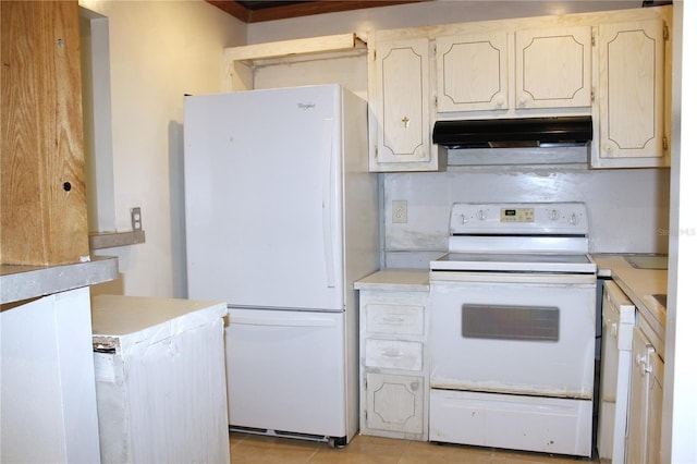 101 Cambridge Trl Unit 194, Sun City Center, FL 33573 - kitchen with white appliances, under cabinet range hood, light countertops, and light tile patterned floors