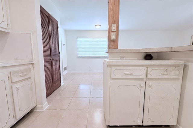 101 Cambridge Trl Unit 194, Sun City Center, FL 33573 - bathroom featuring baseboards, tile patterned floors, and a closet