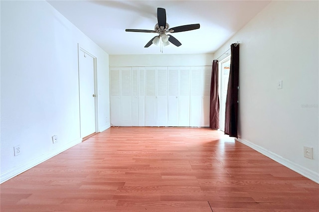 101 Cambridge Trl Unit 194, Sun City Center, FL 33573 - unfurnished bedroom with light wood-type flooring, baseboards, and ceiling fan