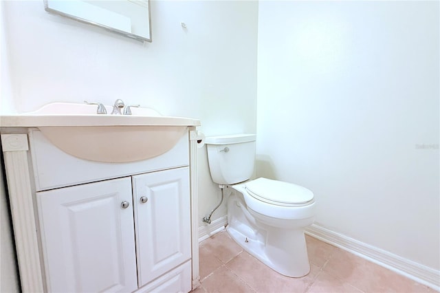 101 Cambridge Trl Unit 194, Sun City Center, FL 33573 - half bath with baseboards, toilet, tile patterned flooring, and vanity