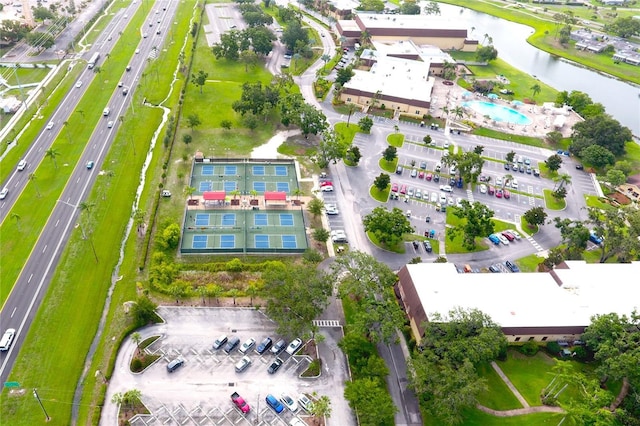 101 Cambridge Trl Unit 194, Sun City Center, FL 33573 - drone / aerial view of a main thoroughfare, a nearby body of water, and a pool