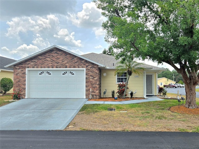 5755 Yorkshire Dr, Zephyrhills, FL 33542 - ranch-style house featuring brick siding, concrete driveway, and a garage
