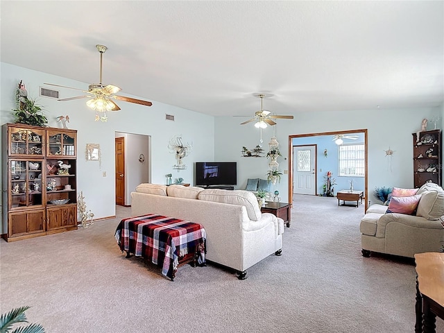 5755 Yorkshire Dr, Zephyrhills, FL 33542 - carpeted living room featuring a ceiling fan