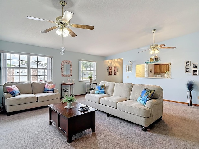 5755 Yorkshire Dr, Zephyrhills, FL 33542 - carpeted living room with ceiling fan and vaulted ceiling