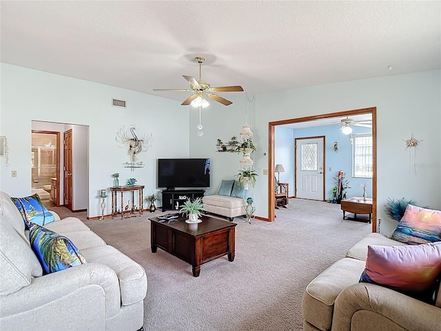 5755 Yorkshire Dr, Zephyrhills, FL 33542 - living area featuring ceiling fan, light colored carpet, and a textured ceiling