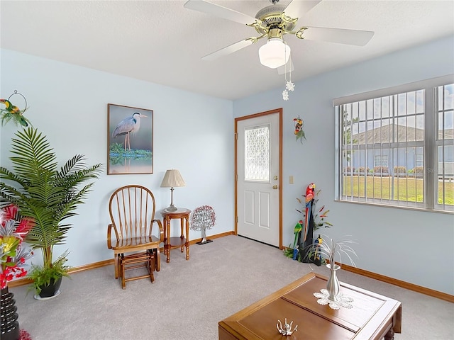 5755 Yorkshire Dr, Zephyrhills, FL 33542 - living area featuring carpet floors and ceiling fan