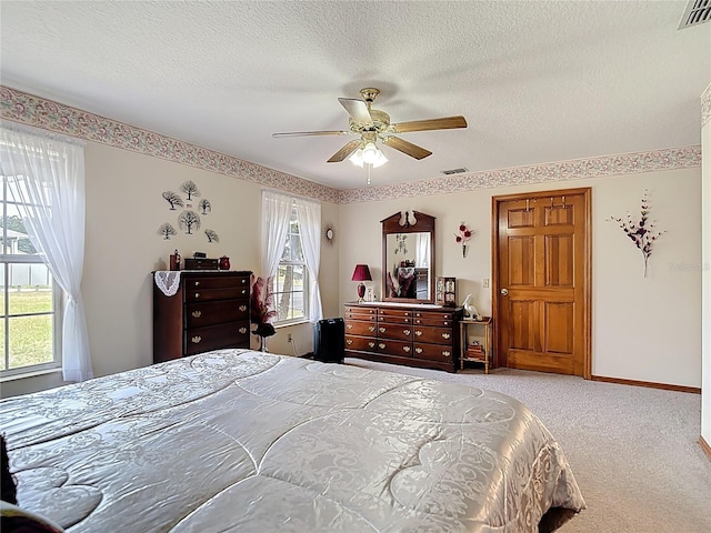 5755 Yorkshire Dr, Zephyrhills, FL 33542 - carpeted bedroom featuring a textured ceiling and a ceiling fan