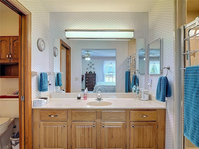 5755 Yorkshire Dr, Zephyrhills, FL 33542 - full bath featuring connected bathroom, wallpapered walls, and vanity