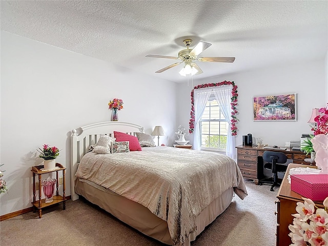 5755 Yorkshire Dr, Zephyrhills, FL 33542 - bedroom featuring light colored carpet, a desk, a textured ceiling, and ceiling fan