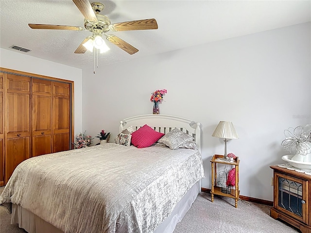 5755 Yorkshire Dr, Zephyrhills, FL 33542 - bedroom with light carpet, a closet, and a ceiling fan