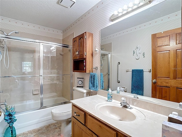 5755 Yorkshire Dr, Zephyrhills, FL 33542 - bathroom featuring vanity, a textured ceiling, combined bath / shower with glass door, and wallpapered walls