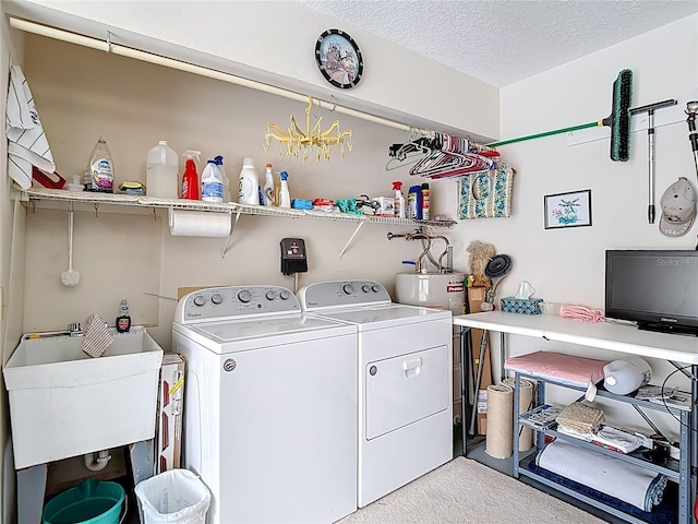 5755 Yorkshire Dr, Zephyrhills, FL 33542 - laundry room with washer and dryer, light colored carpet, and a textured ceiling