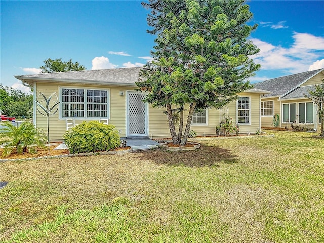 5755 Yorkshire Dr, Zephyrhills, FL 33542 - view of front of property with a front lawn