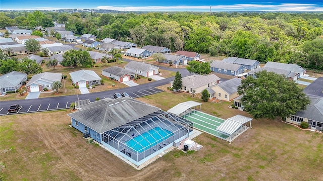 5755 Yorkshire Dr, Zephyrhills, FL 33542 - aerial perspective of suburban area with a heavily wooded area