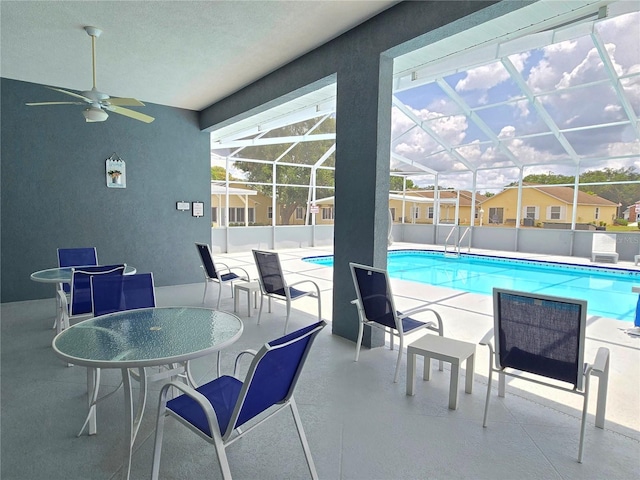 5755 Yorkshire Dr, Zephyrhills, FL 33542 - outdoor pool featuring a patio area and ceiling fan