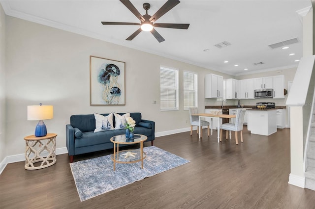 106 Cutlass Way, Oldsmar, FL 34677 - living area with crown molding, a ceiling fan, dark wood-style floors, and recessed lighting