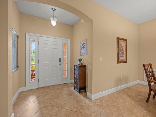 27546 Stonecreek Way, Wesley Chapel, FL 33544 - entrance foyer featuring arched walkways and light tile patterned floors