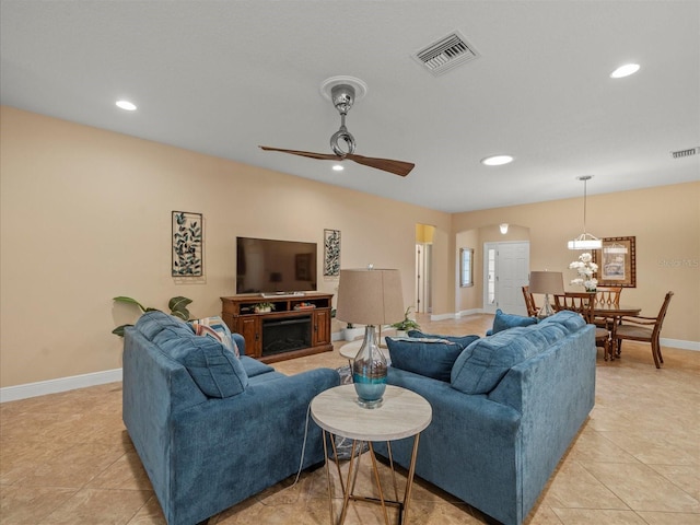 27546 Stonecreek Way, Wesley Chapel, FL 33544 - living room with light tile patterned flooring, recessed lighting, a ceiling fan, and a fireplace